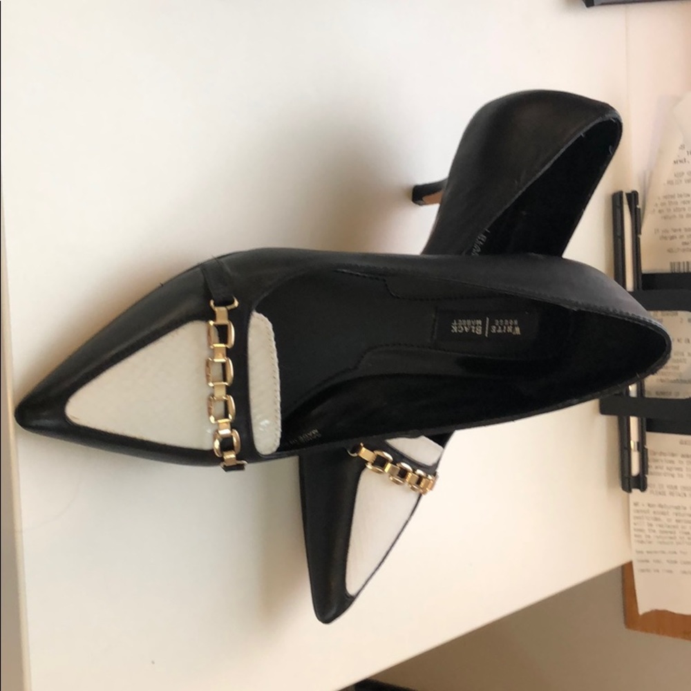 Black & white pumps. Tags are still on the bottom.